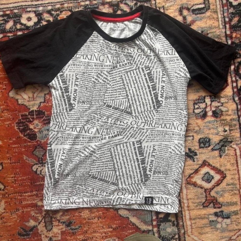Truth Substance white and black newspaper print baby tee